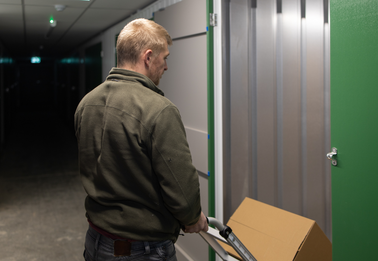 Man unloading his items in a storage unit