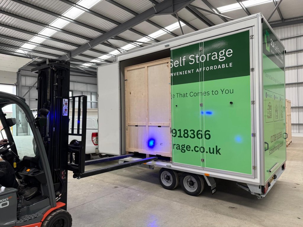 Unloading a mobile storage unit box with a fork lift